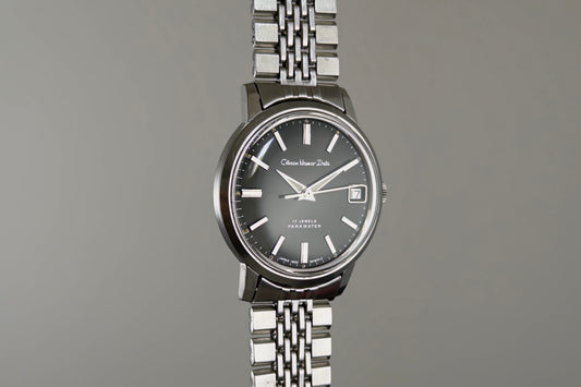 Citizen Homer Date 63-2058 seen from the front on its beads-of-rice bracelet