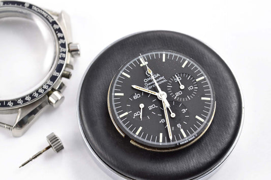 Replacing the crystal on a vintage Omega Speedmaster watch after an amateur watch repair attempt