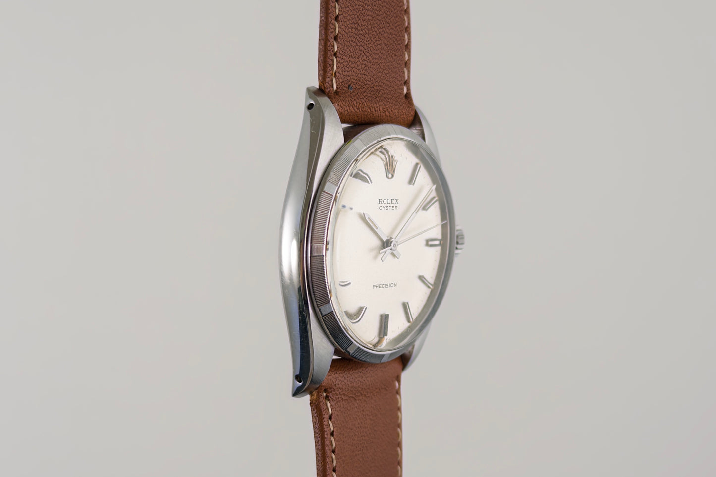 Side profile of the Rolex Oyster Precision 6426 case and its brown leather strap