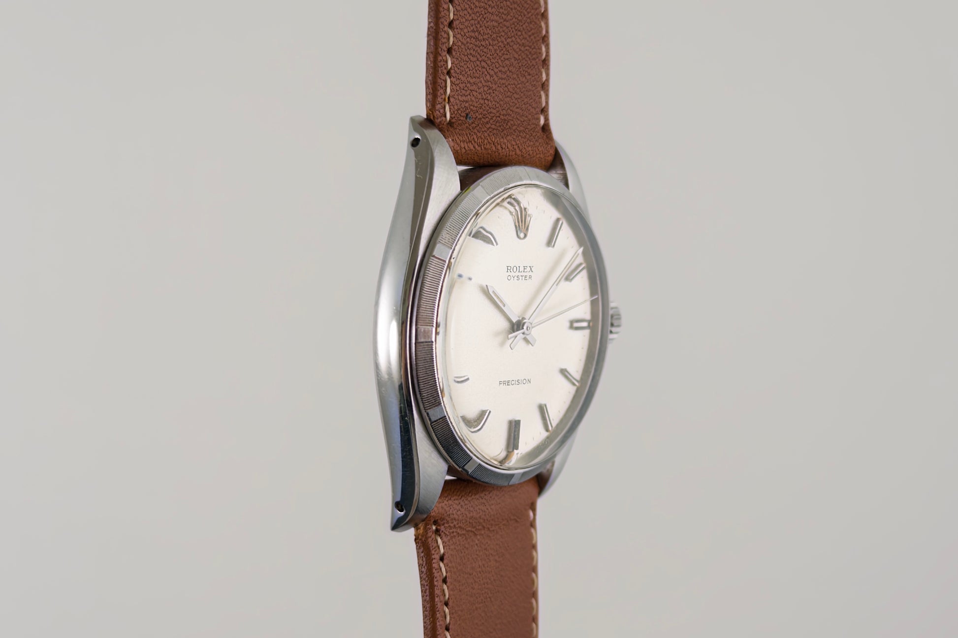 Side profile of the Rolex Oyster Precision 6426 case and its brown leather strap