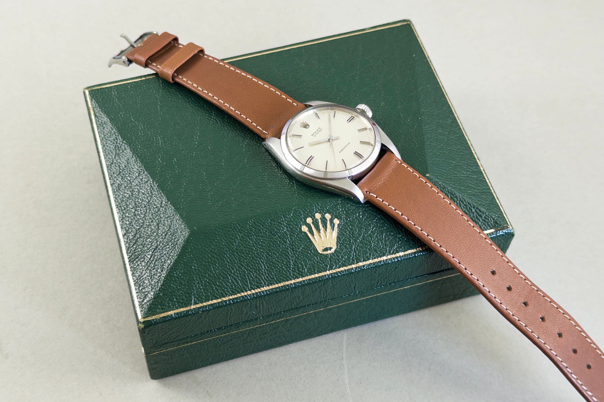 Rolex Oyster Precision 6426 resting on its original green Rolex box