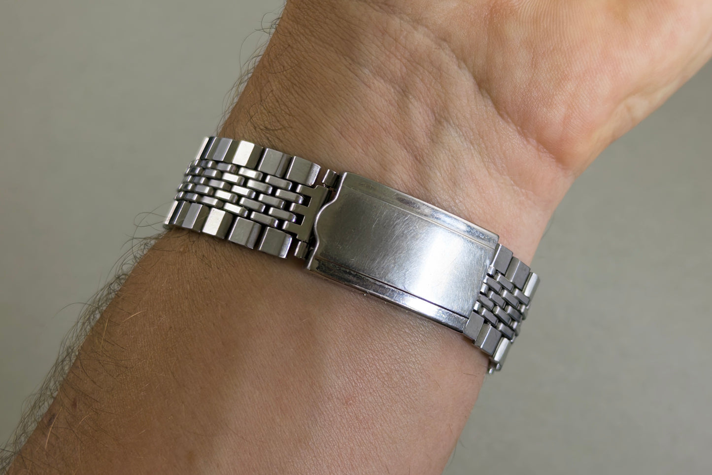 Signed Citizen folding clasp of the beads-of-rice bracelet closed on the wrist