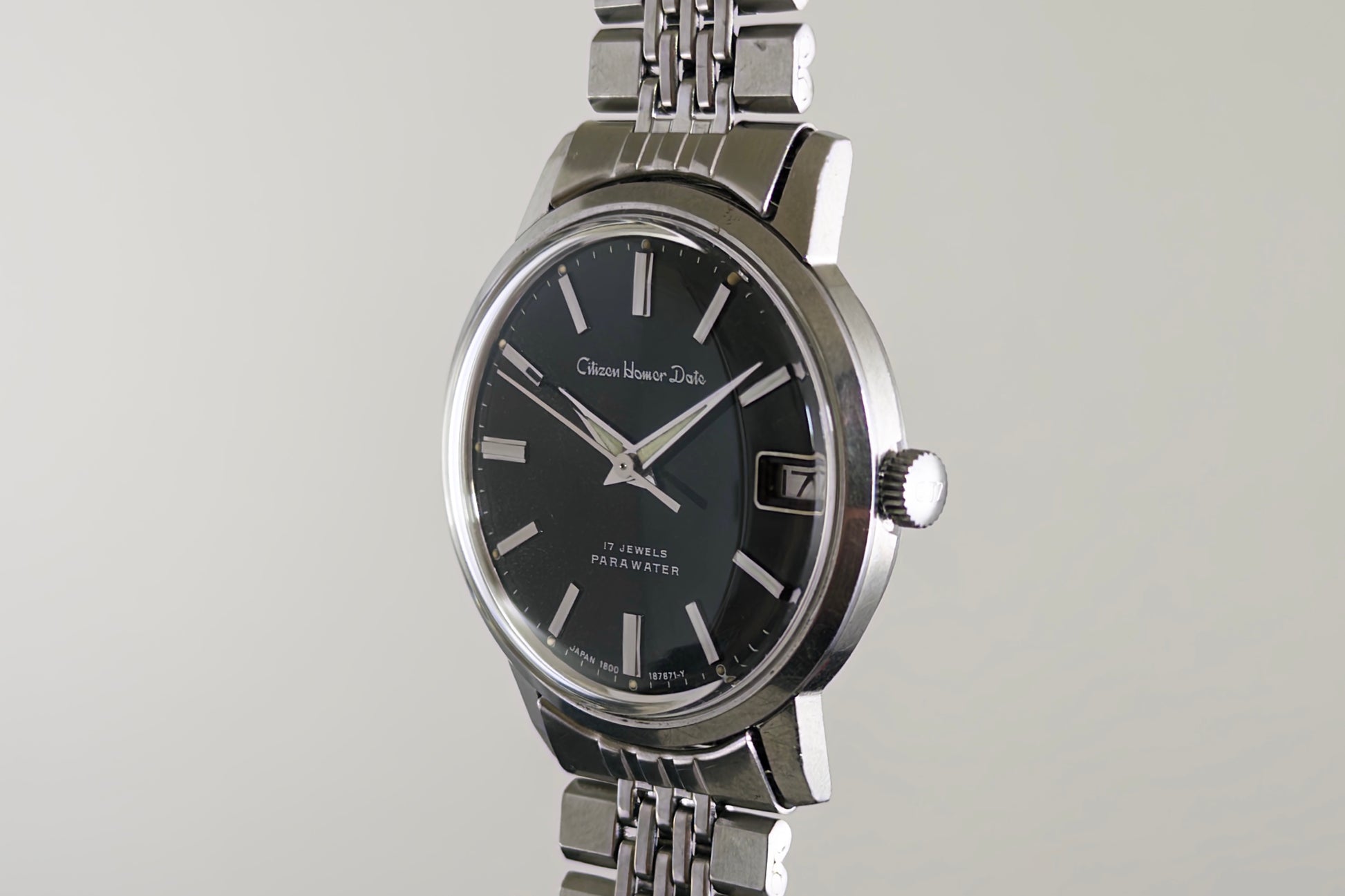 Citizen Homer Date 63-2058 at an angle showing the crown and polished steel case