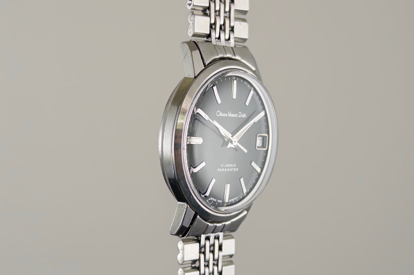 Three-quarter view of the Citizen Homer Date 63-2058 case and bracelet