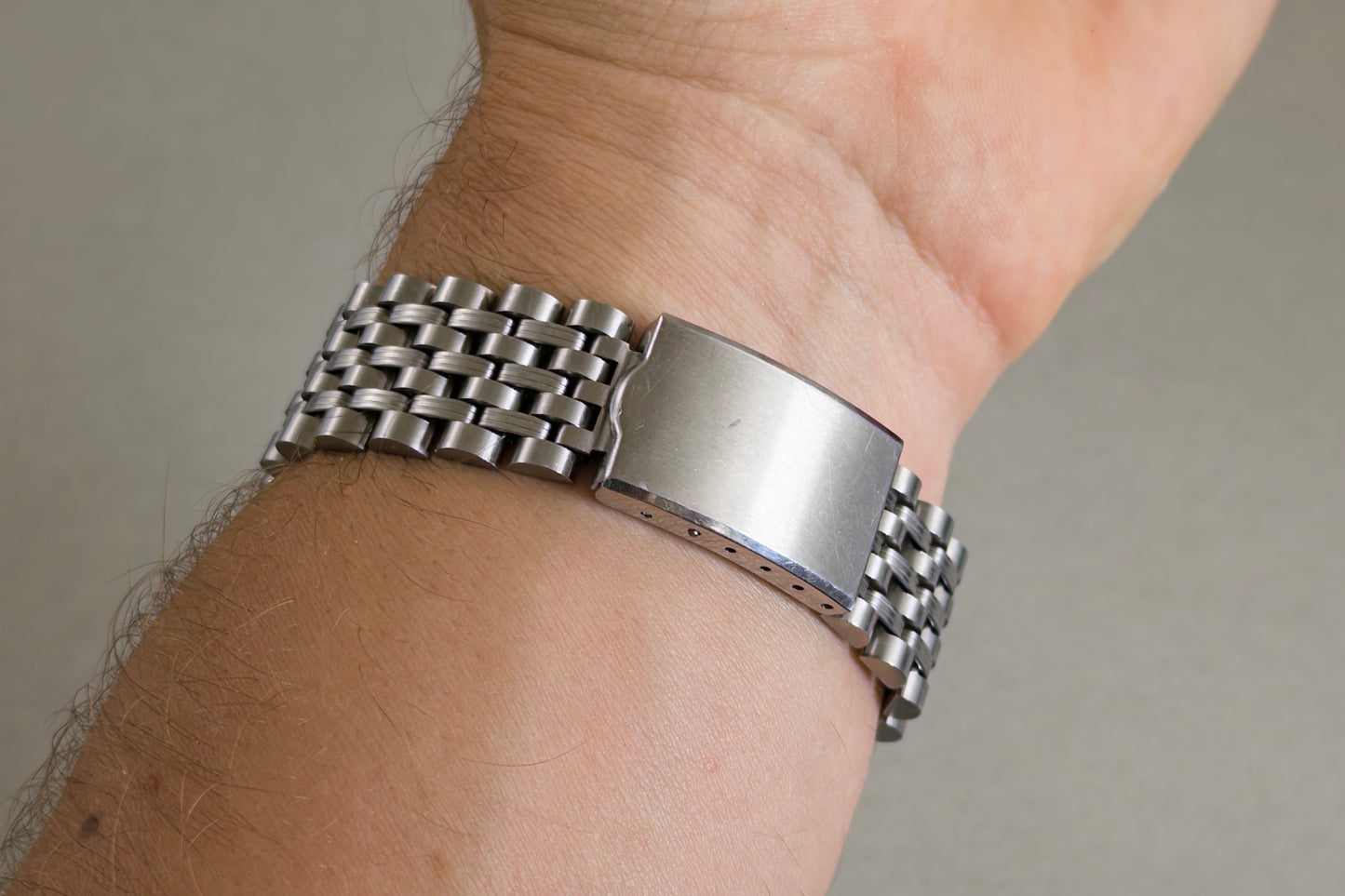 Folding clasp of the Vostok Komandirskie steel bracelet closed on the wrist