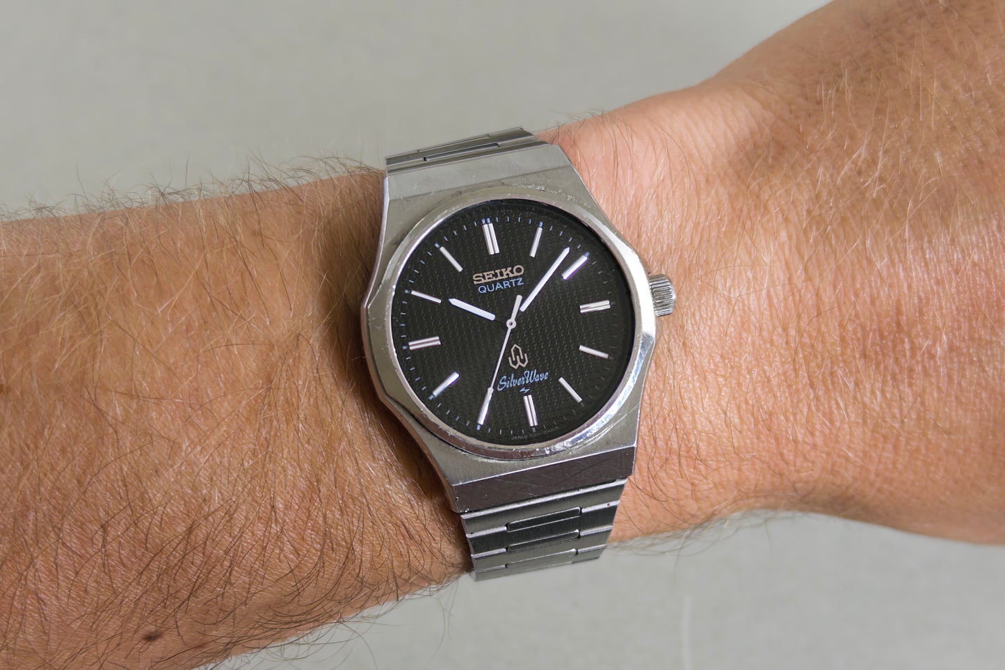 Seiko Silverwave 7121-703B worn on the wrist on its integrated steel bracelet