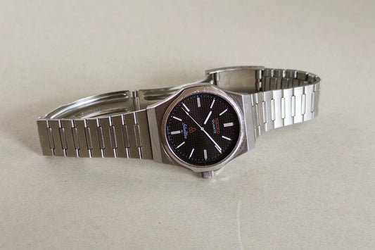 Seiko Silverwave 7121-703B laid flat showing its integrated steel bracelet