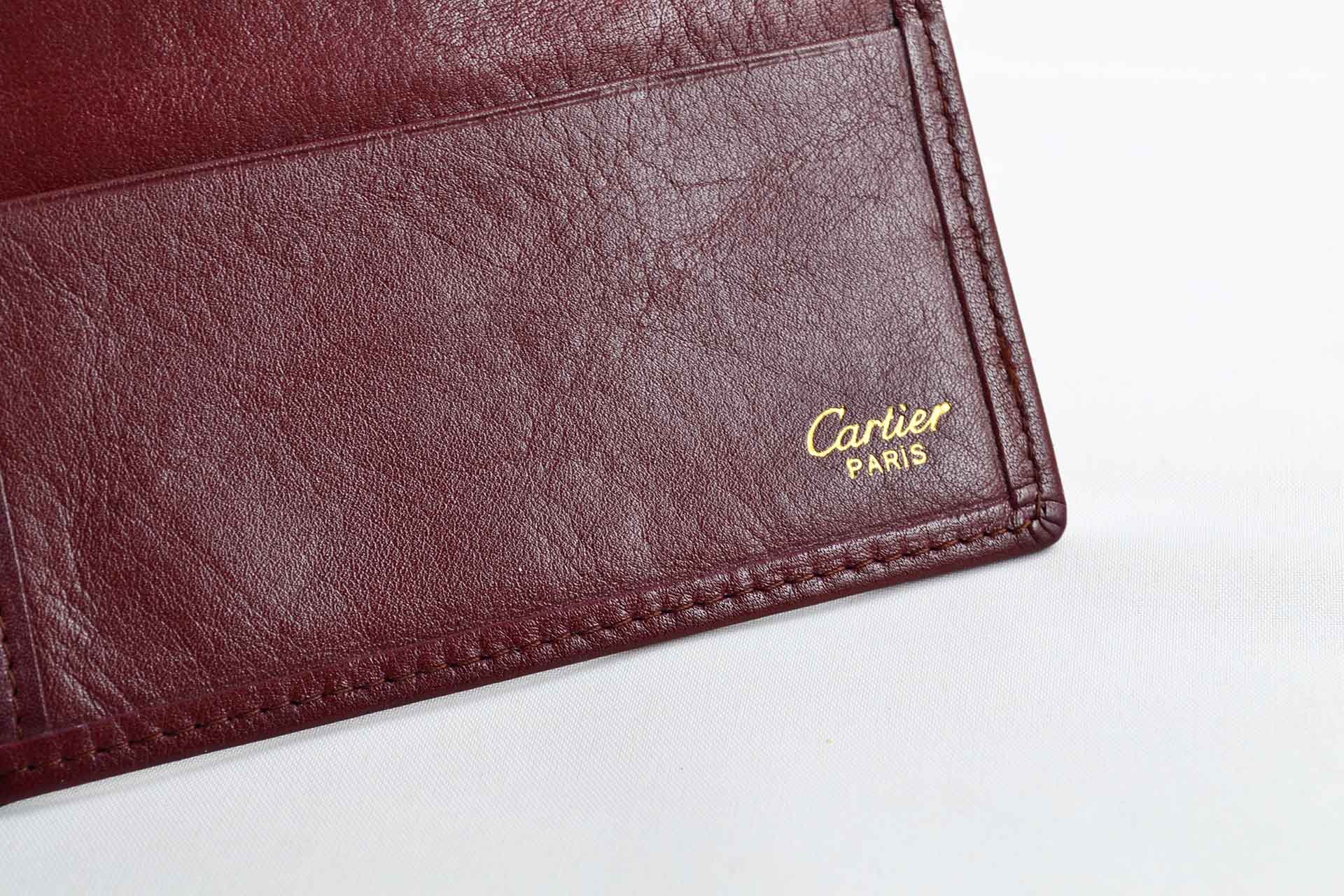 Cartier - Portefeuille Must de Cartier en cuir bordeaux - LumeVille